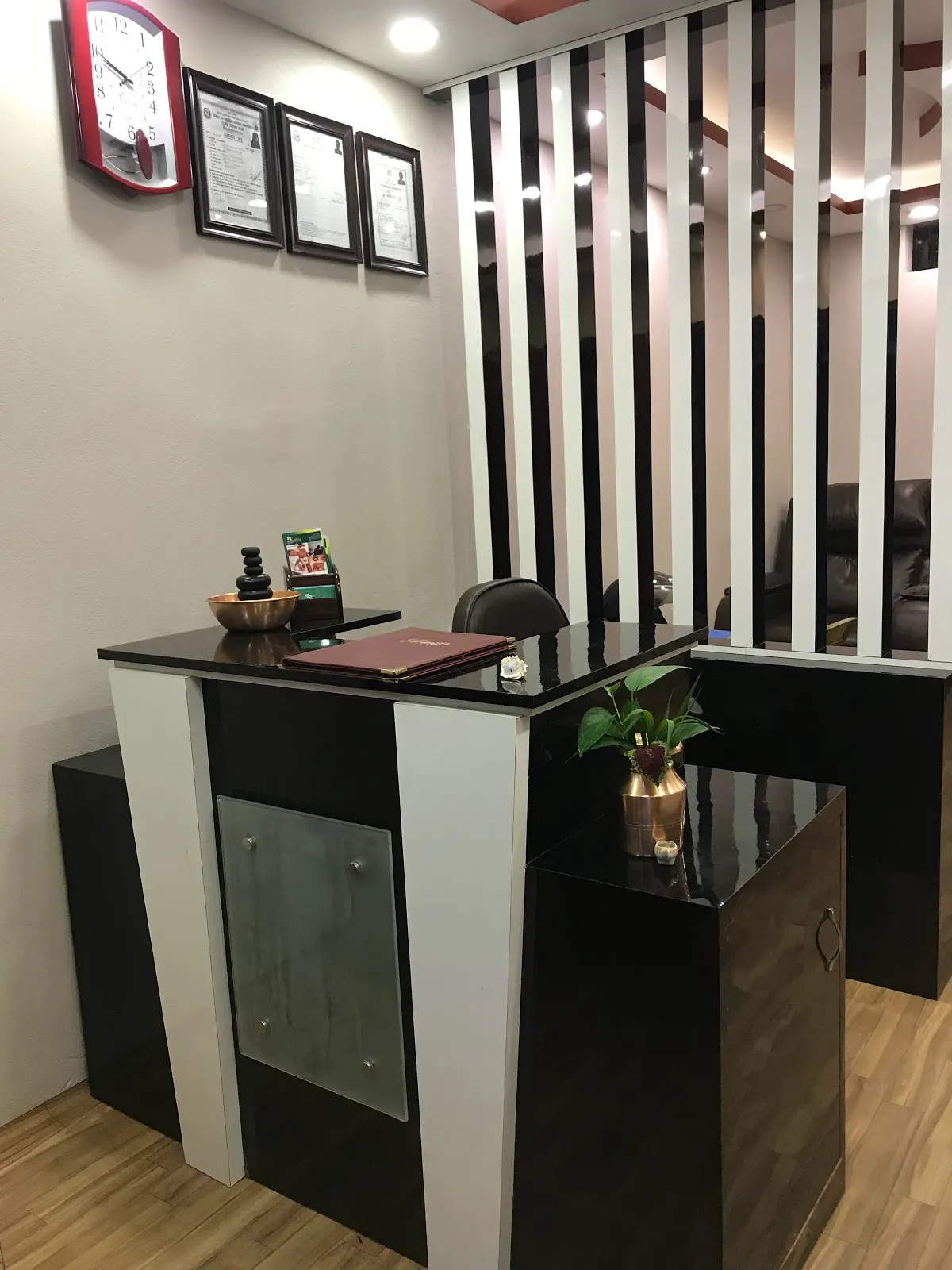 Reception desk with monochrome panelling and welcome kit
